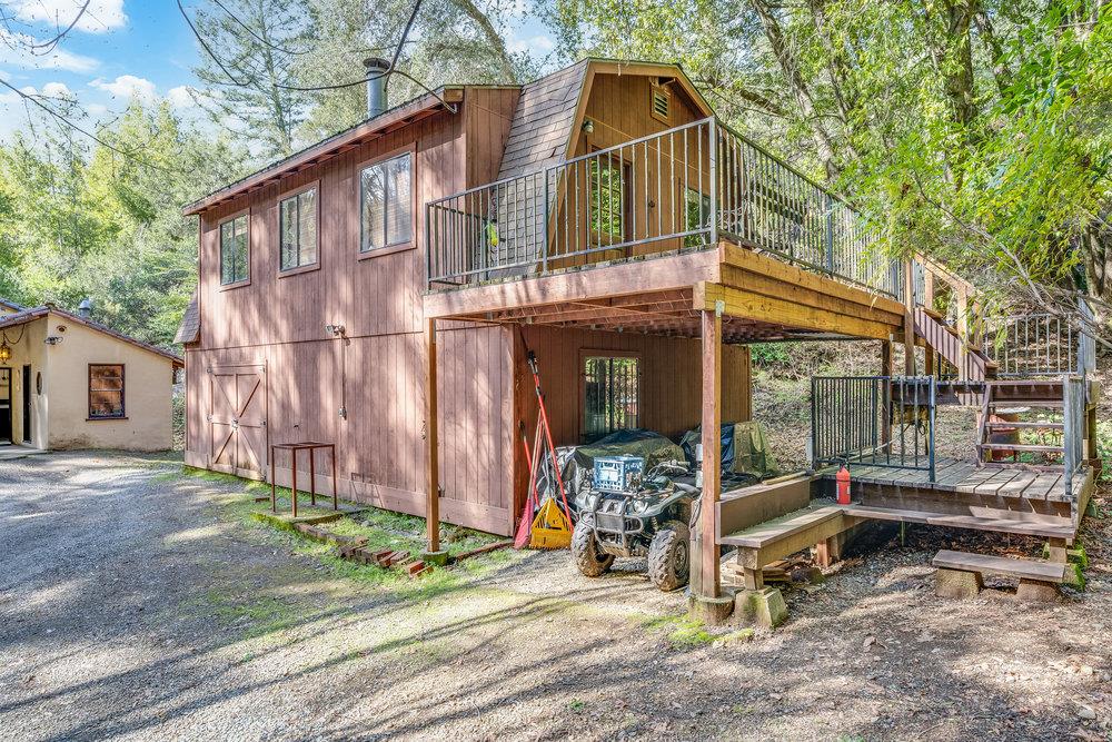 22200 Aldercroft Heights Road Los Gatos, CA 95033 - Photo 16 of 45 a backyard of a house with barbeque oven table and chairs