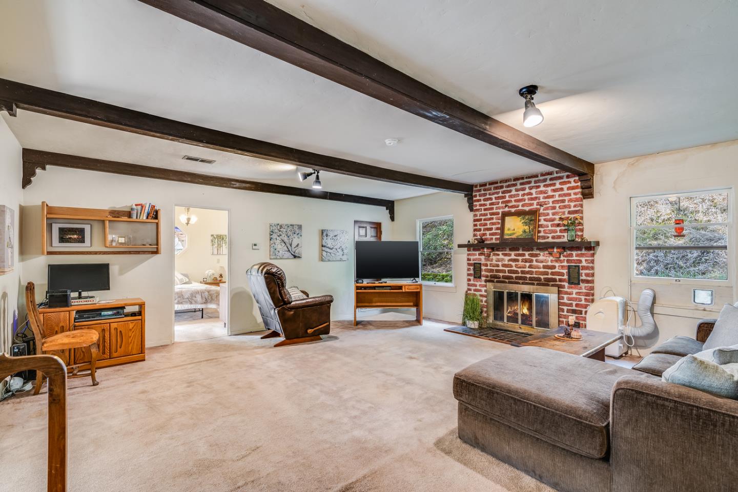 22200 Aldercroft Heights Road Los Gatos, CA 95033 - Photo 9 of 45 a living room with furniture and a fireplace