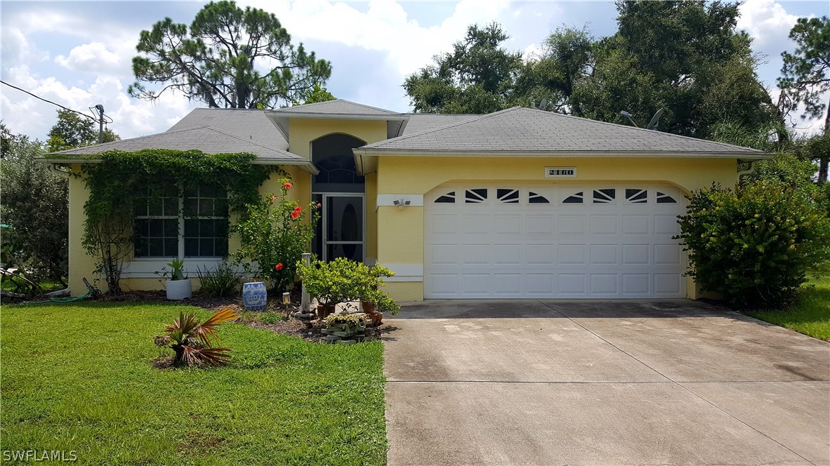 2160 Gardner Road Alva, FL 33920 - Photo 1 of 21 a view of swimming pool with garden