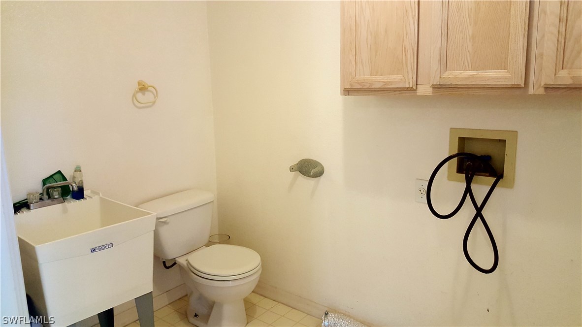 2160 Gardner Road Alva, FL 33920 - Photo 13 of 21 a bathroom with a toilet and a sink
