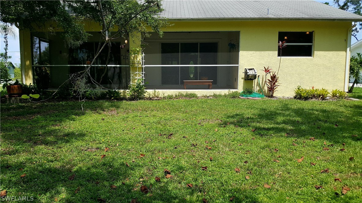 2160 Gardner Road Alva, FL 33920 - Photo 16 of 21 a backyard of a house with lots of green space and plants