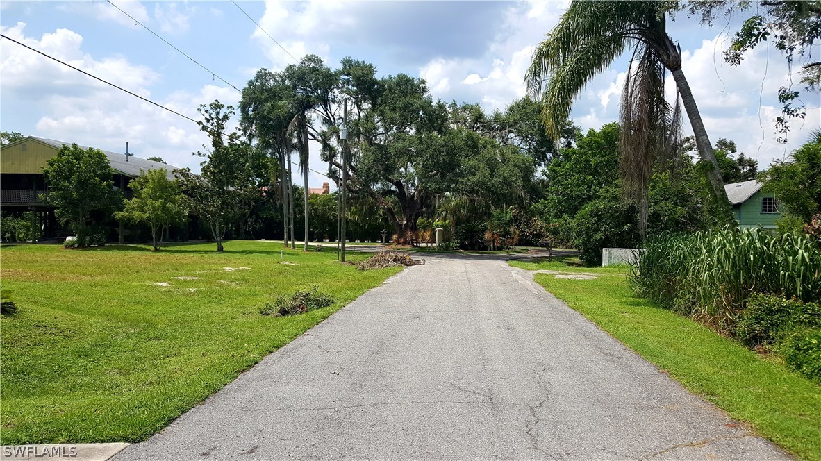 2160 Gardner Road Alva, FL 33920 - Photo 20 of 21 a view of swimming pool with a yard