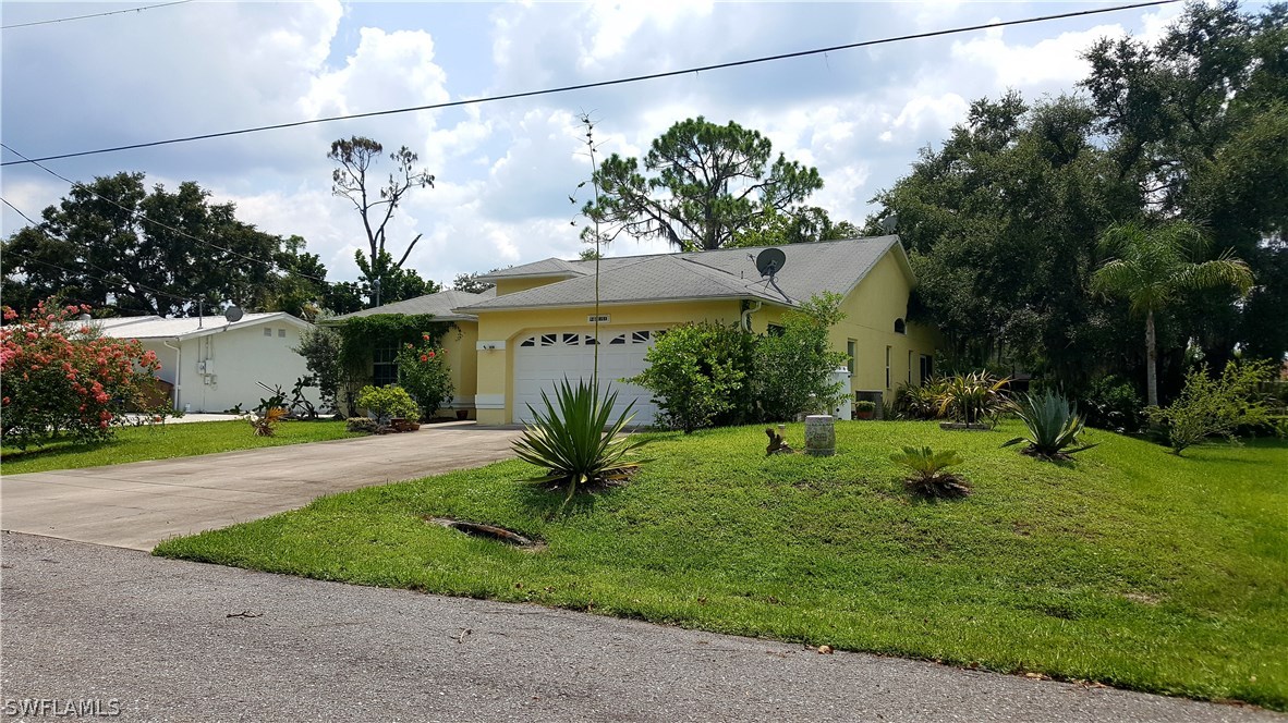 2160 Gardner Road Alva, FL 33920 - Photo 2 of 21 a view of a house with a yard
