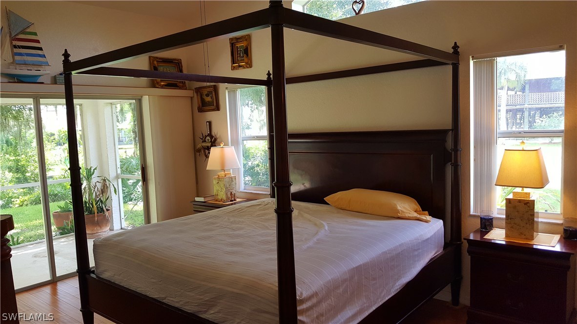 2160 Gardner Road Alva, FL 33920 - Photo 8 of 21 a bedroom with a bed and large windows