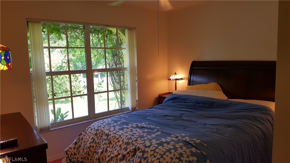 2160 Gardner Road Alva, FL 33920 - Photo 10 of 21 a bedroom with a bed and a window