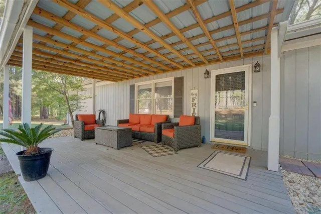 a living room with patio furniture