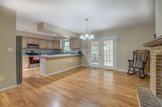 a view of a kitchen with microwave and cabinets