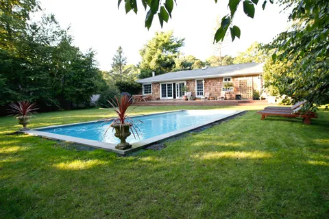 a front view of a house with swimming pool