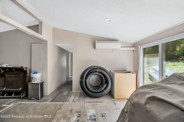 a bedroom with a bed and a view of bedroom