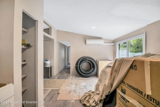 a view of a livingroom with furniture and windows