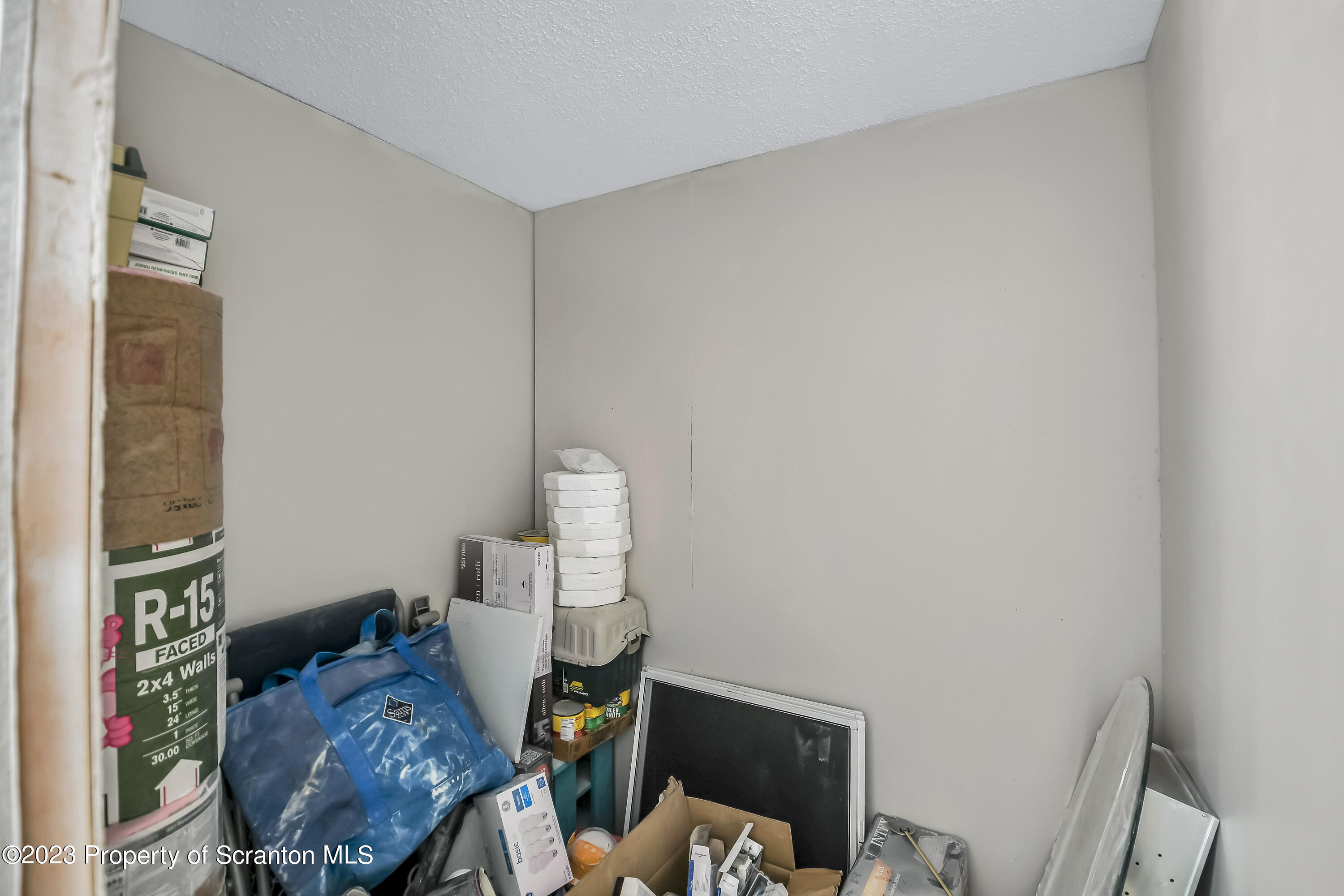 11715 Forest Lake Road Montrose, PA 18801 - Photo 18 of 40 a living room with furniture and a mirror