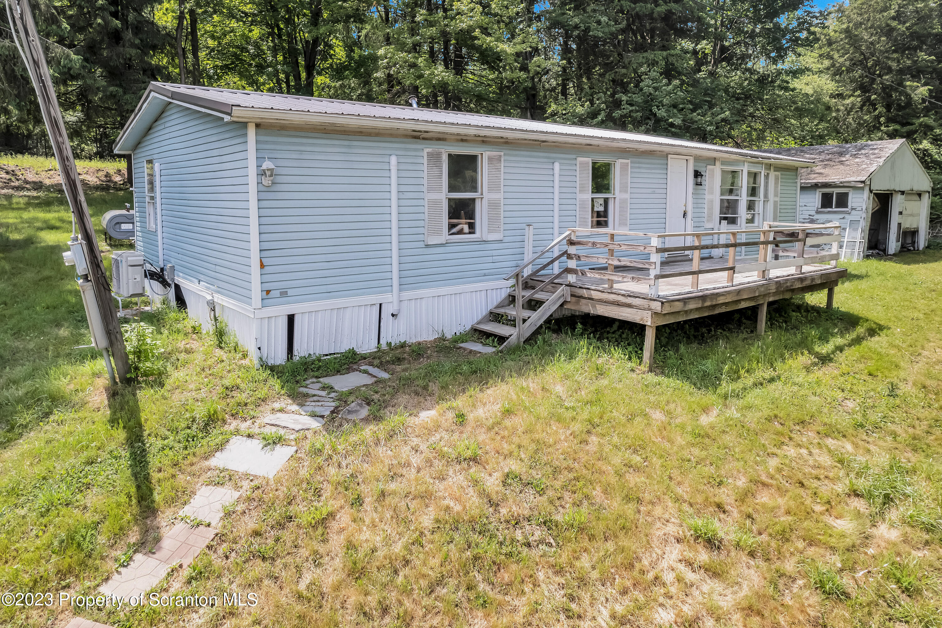11715 Forest Lake Road Montrose, PA 18801 - Photo 2 of 40 a backyard of a house with yard barbeque oven and outdoor seating