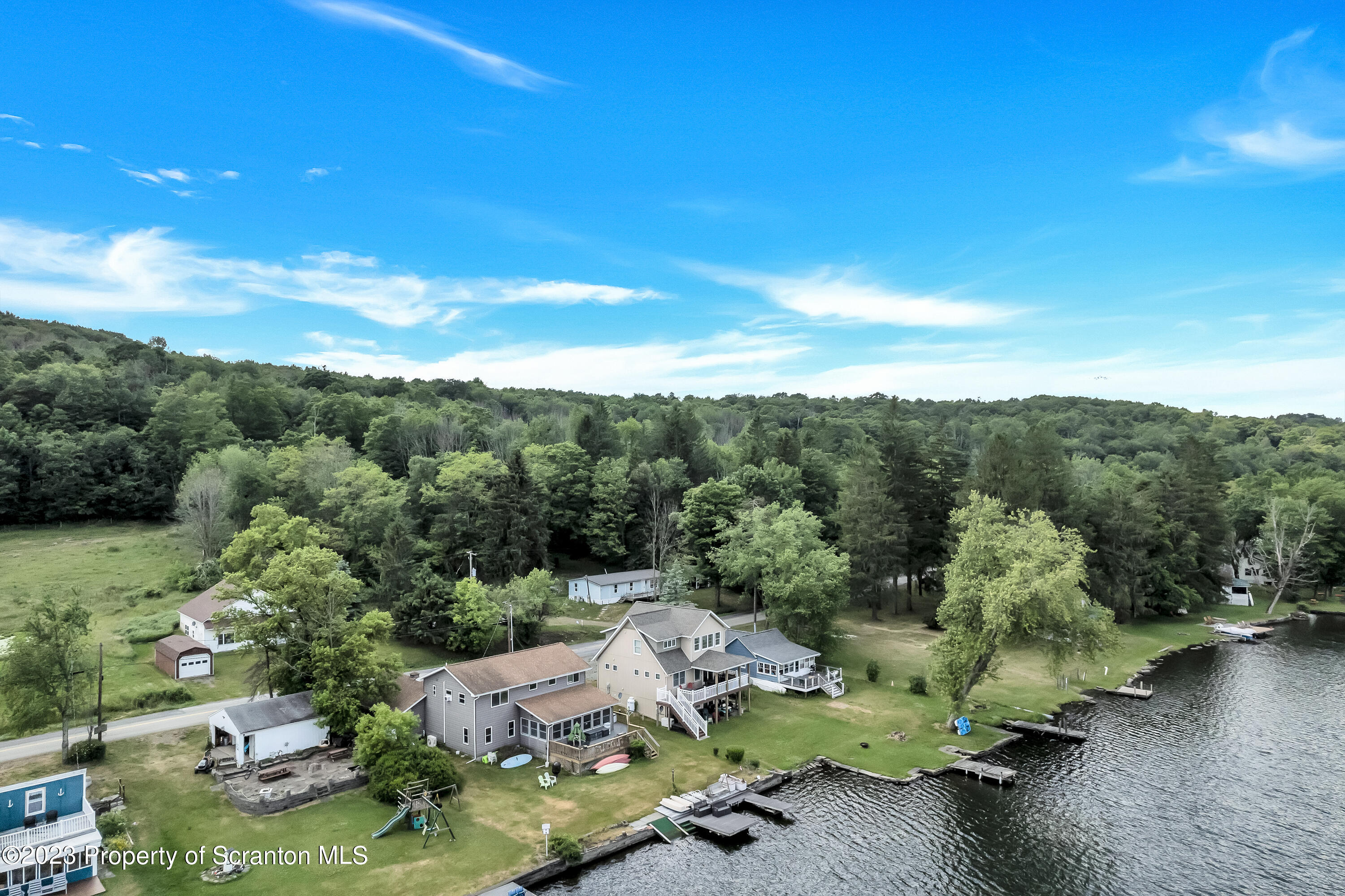 11715 Forest Lake Road Montrose, PA 18801 - Photo 9 of 40 a view of a lake with a mountain in the background