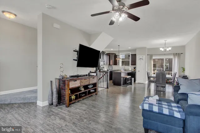 a view of a livingroom with furniture and a flat screen tv