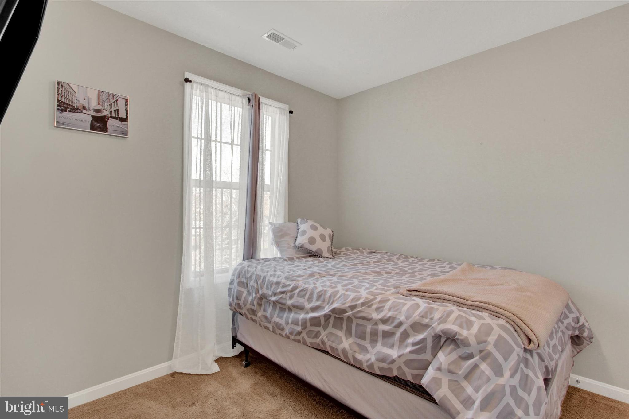 30 Brookside Avenue Hanover, PA 17331 - Photo 19 of 23 a bedroom with a bed and a window