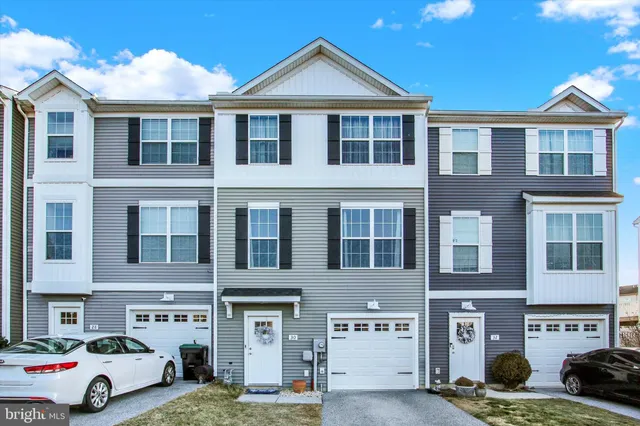 a car parked in front of a brick building