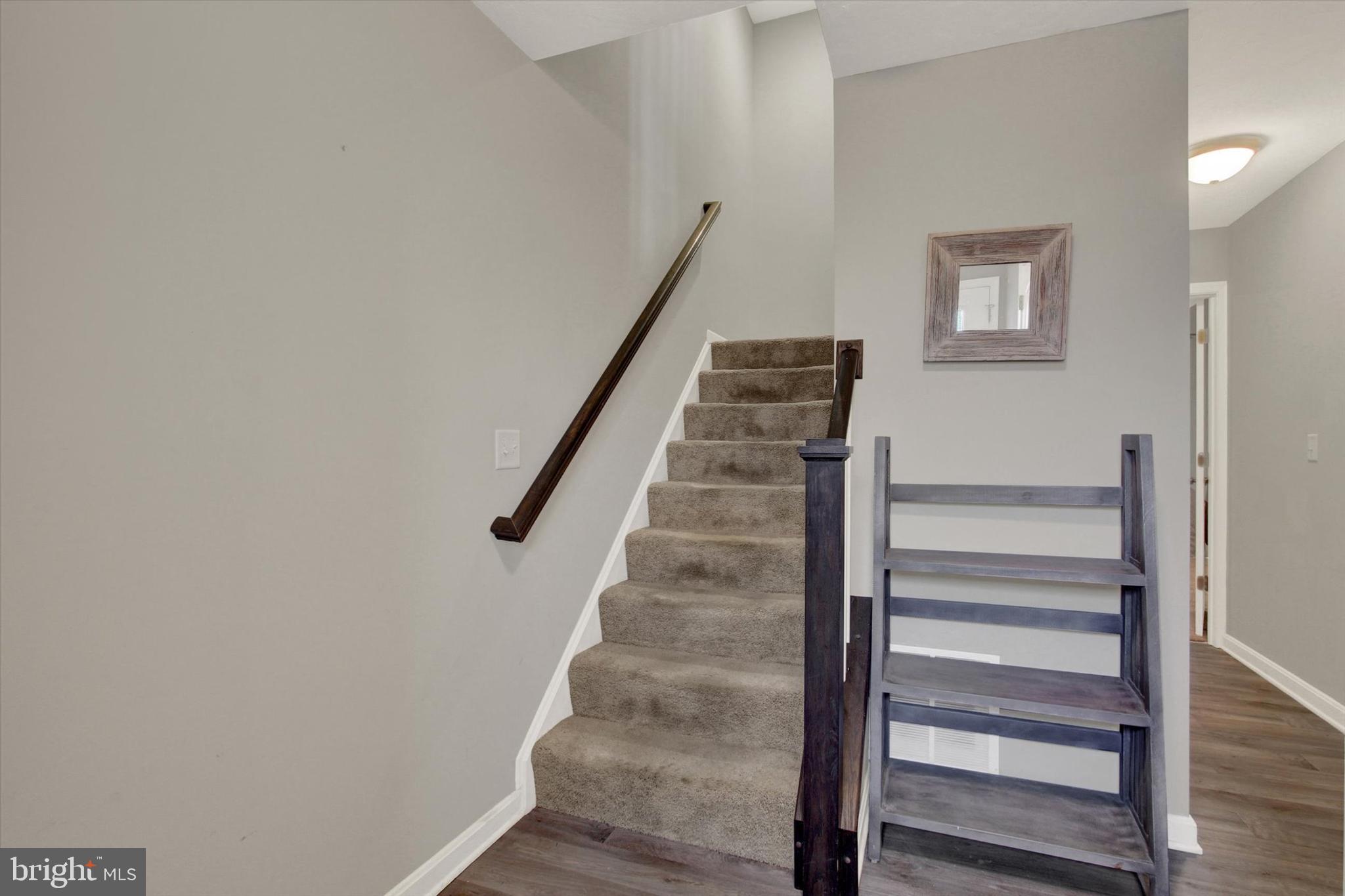 30 Brookside Avenue Hanover, PA 17331 - Photo 6 of 23 a view of staircase with wooden floor and white walls