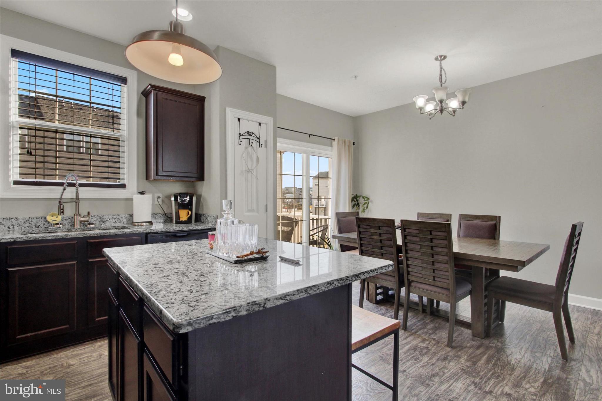 30 Brookside Avenue Hanover, PA 17331 - Photo 9 of 23 a kitchen with granite countertop sink stove and dining table