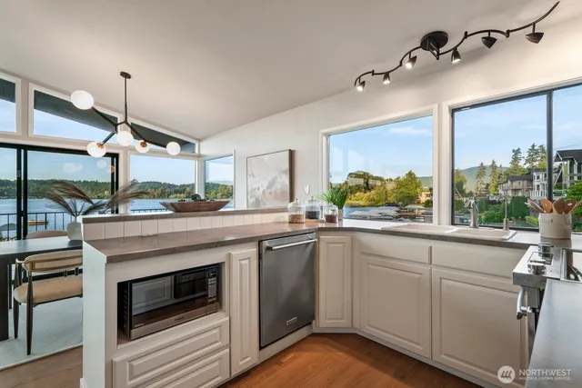 a kitchen with a sink and cabinets