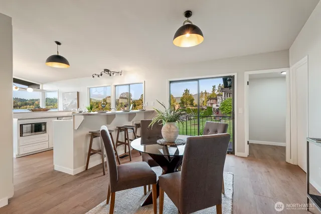 a view of a dining room with furniture window and wooden floor