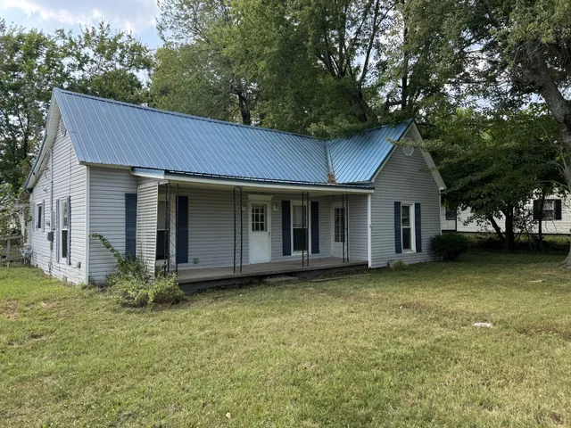 a view of a house with a garden