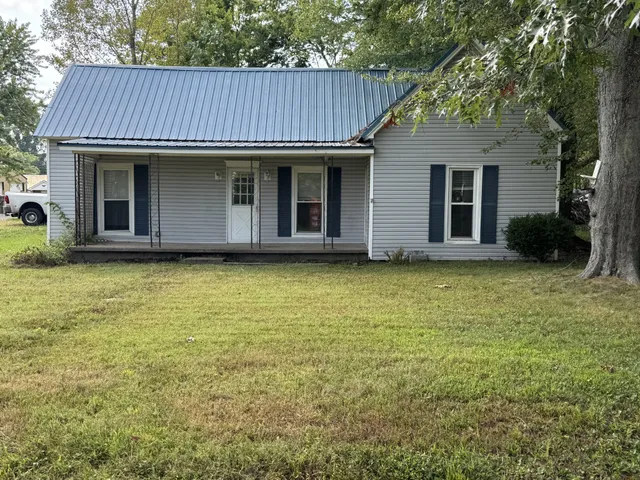 a view of a house with a garden
