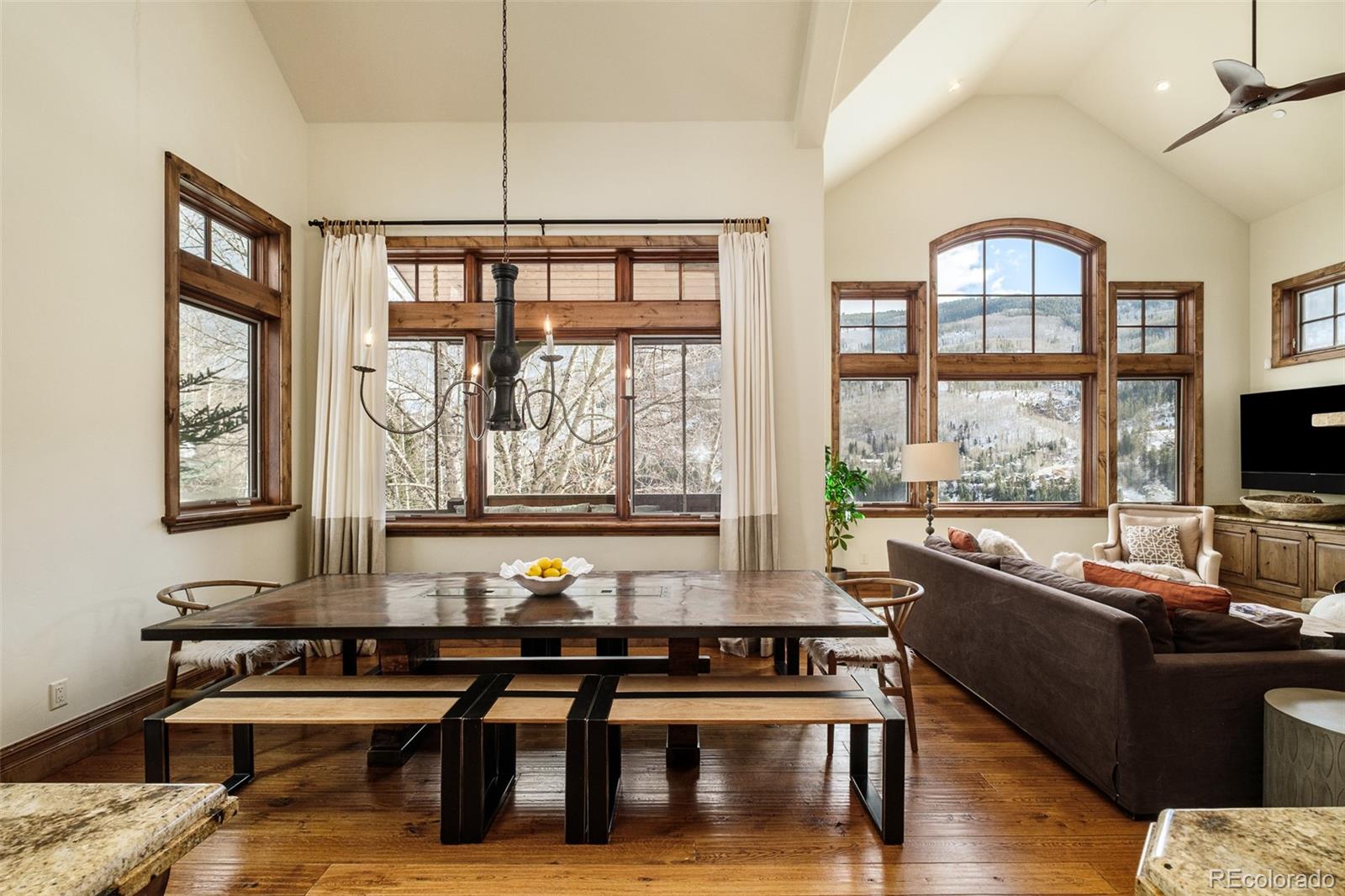 2417 Garmisch Drive, Unit B Vail, CO 81657 - Photo 16 of 43 a living room with furniture and a floor to ceiling window
