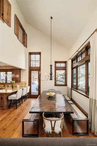 a large kitchen with a table and chairs