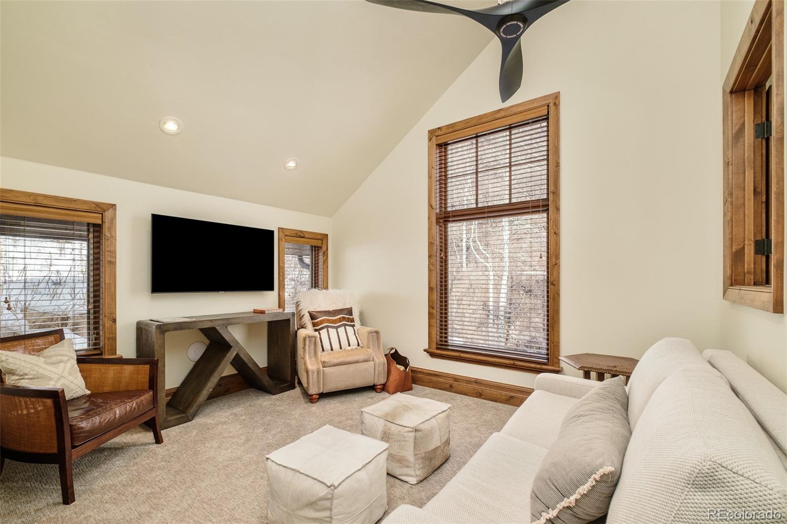 2417 Garmisch Drive, Unit B Vail, CO 81657 - Photo 28 of 43 a living room with furniture and a flat screen tv