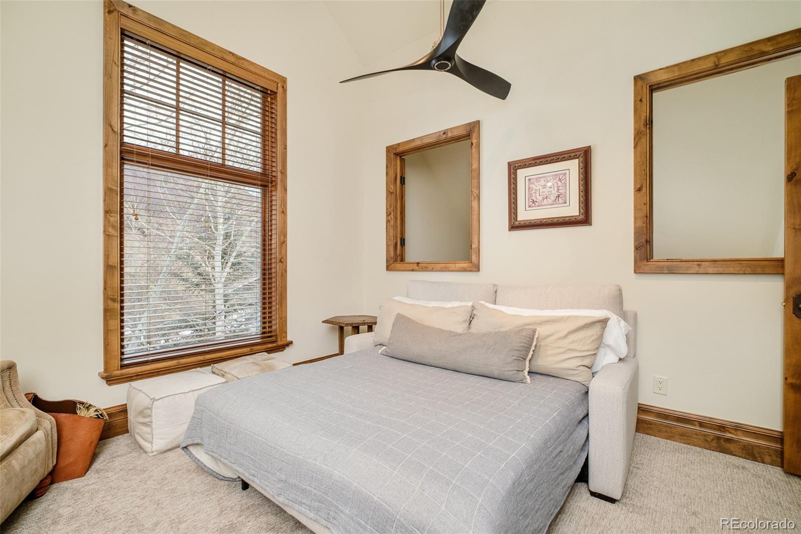 2417 Garmisch Drive, Unit B Vail, CO 81657 - Photo 29 of 43 a bedroom with a bed and a window