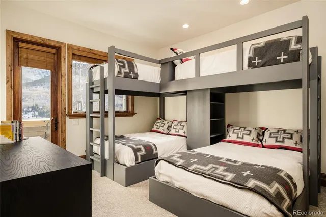 a view of cabinets with granite countertop a sink and a mirror