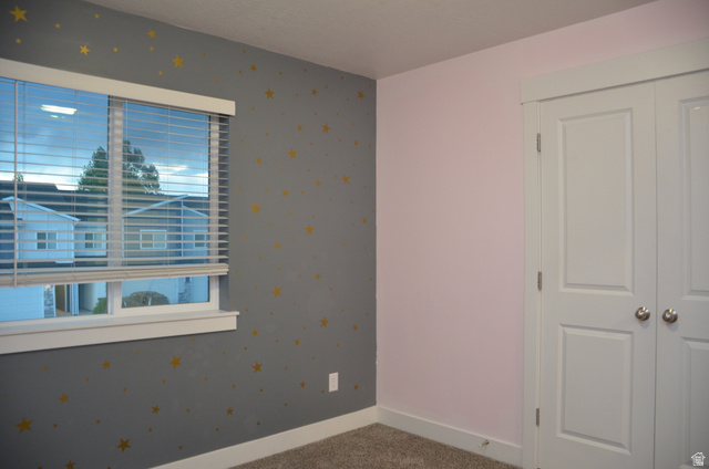 1842 South 1280th Street West Logan, UT 84321 - Photo 15 of 21 Interior room with a double-pane window featuring white blinds, framed by white trim