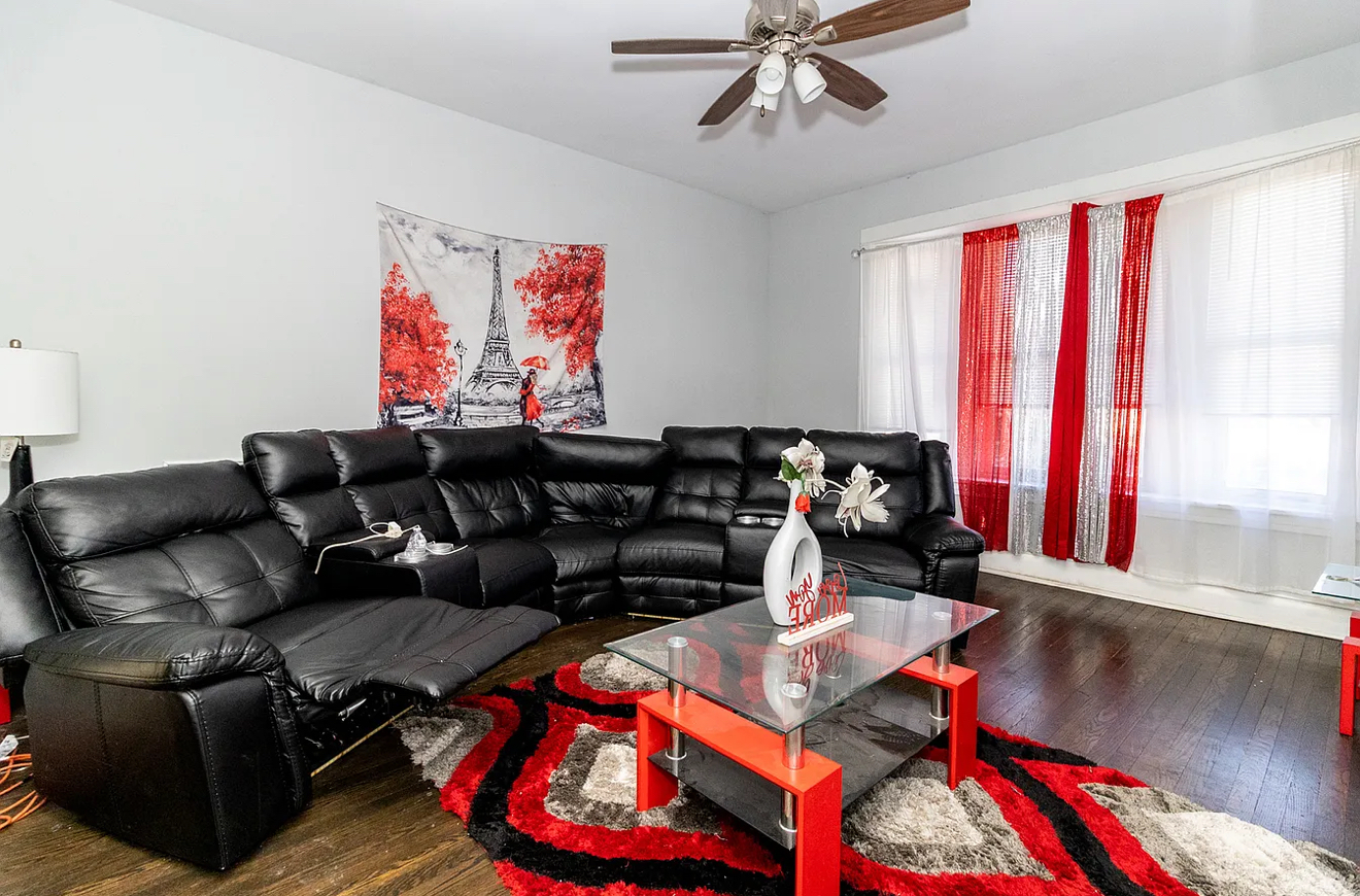 5523 West Huron Street Chicago, IL 60644 - Photo 5 of 10 a living room with furniture and a window
