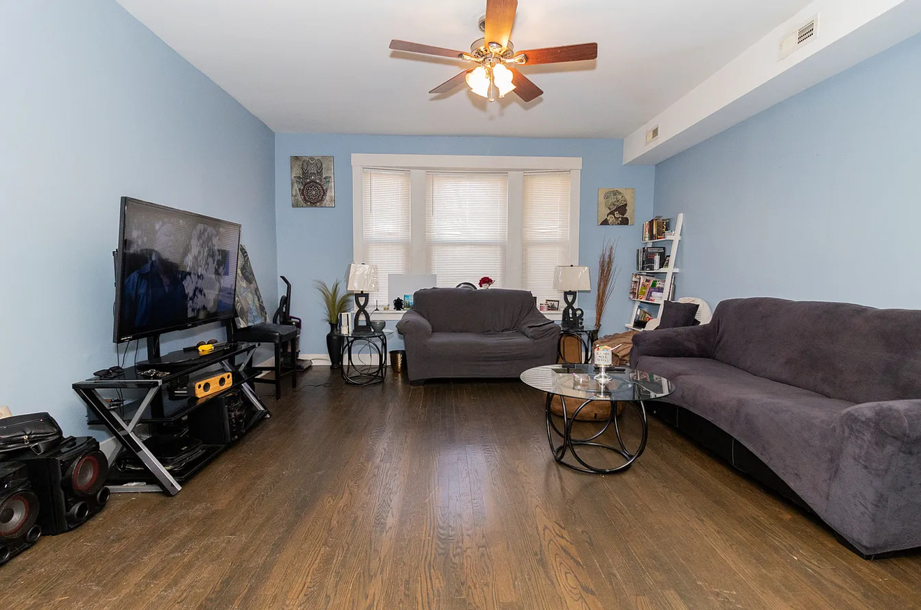 5523 West Huron Street Chicago, IL 60644 - Photo 7 of 10 a living room with furniture and a flat screen tv