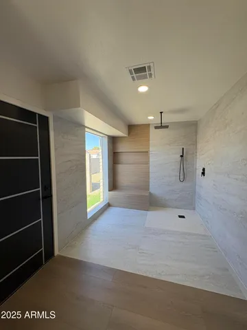 a view of an empty room with a window