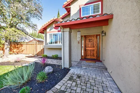 a view of a house with a small yard