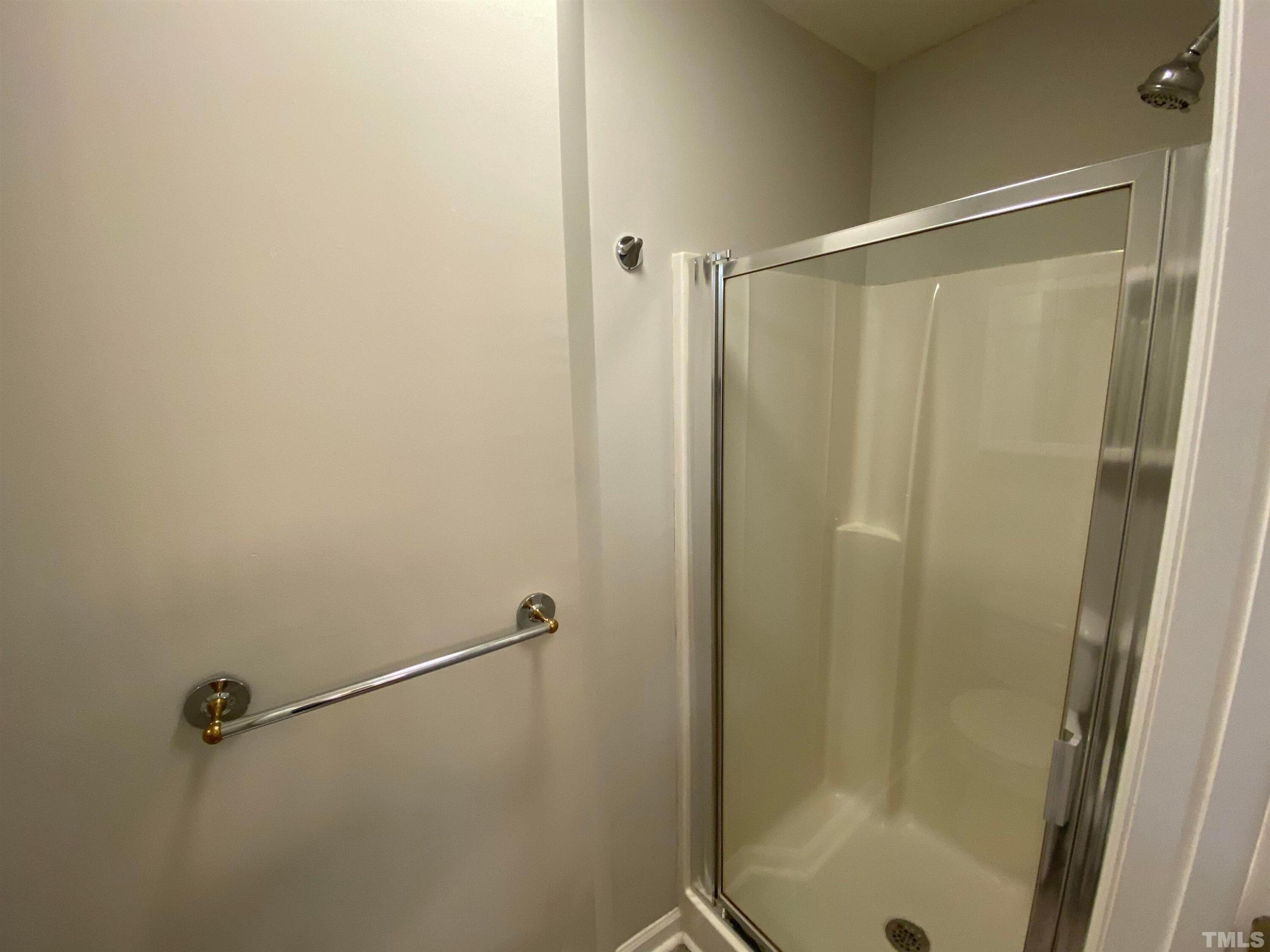 2413 Wellington Ridge Loop, Unit 2413 Cary, NC 27518 - Photo 20 of 30 a bathroom with a shower