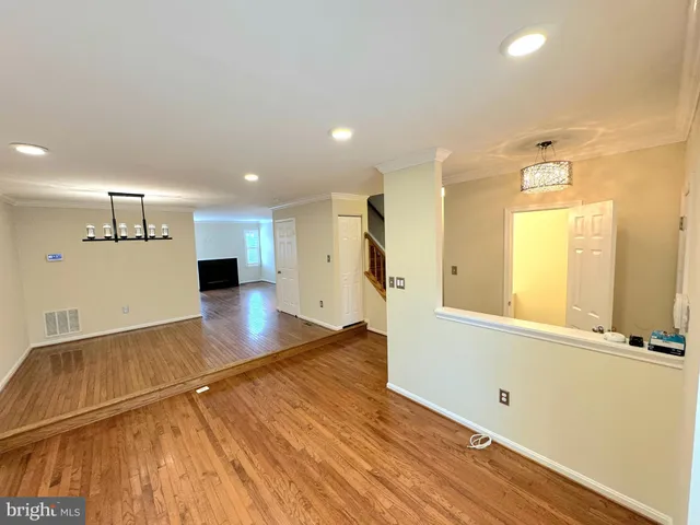 a view of a kitchen with a sink and a wooden floor