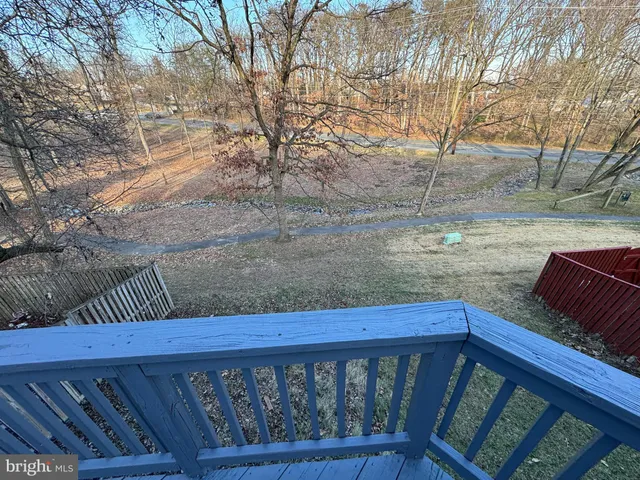 a view of a house with wooden deck