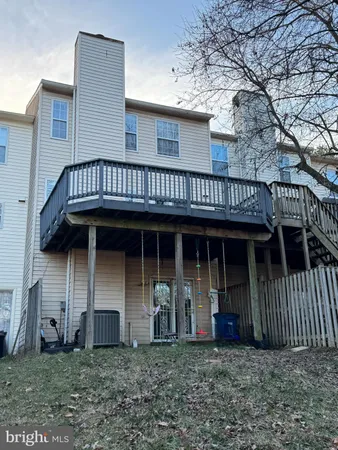 a front view of a residential apartment building with a yard