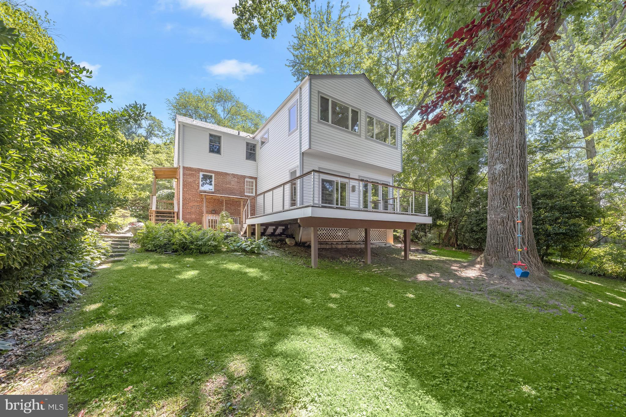 8800 Maywood Avenue Silver Spring, MD 20910 - Photo 35 of 41 a view of a house with a backyard porch and sitting area
