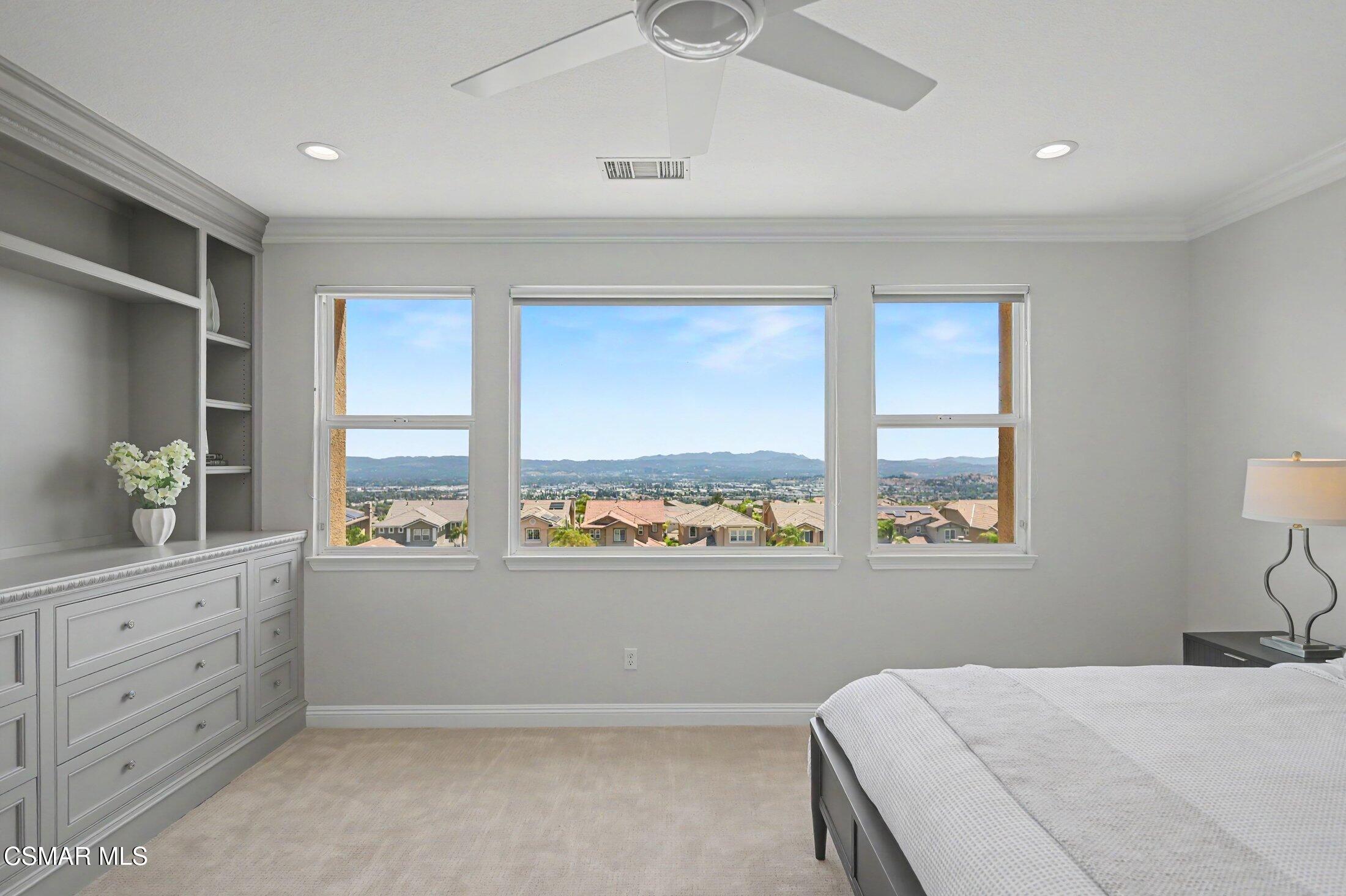20800 Sardinia Way Porter Ranch, CA 91326 - Photo 26 of 57 a bedroom with a large bed and a window