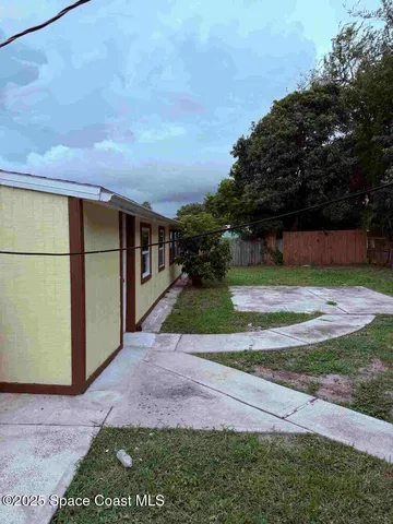 a view of backyard with green space