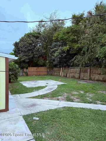 a view of a yard with a swimming pool