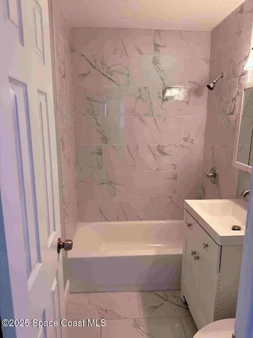 a bathroom with a sink and a bathtub