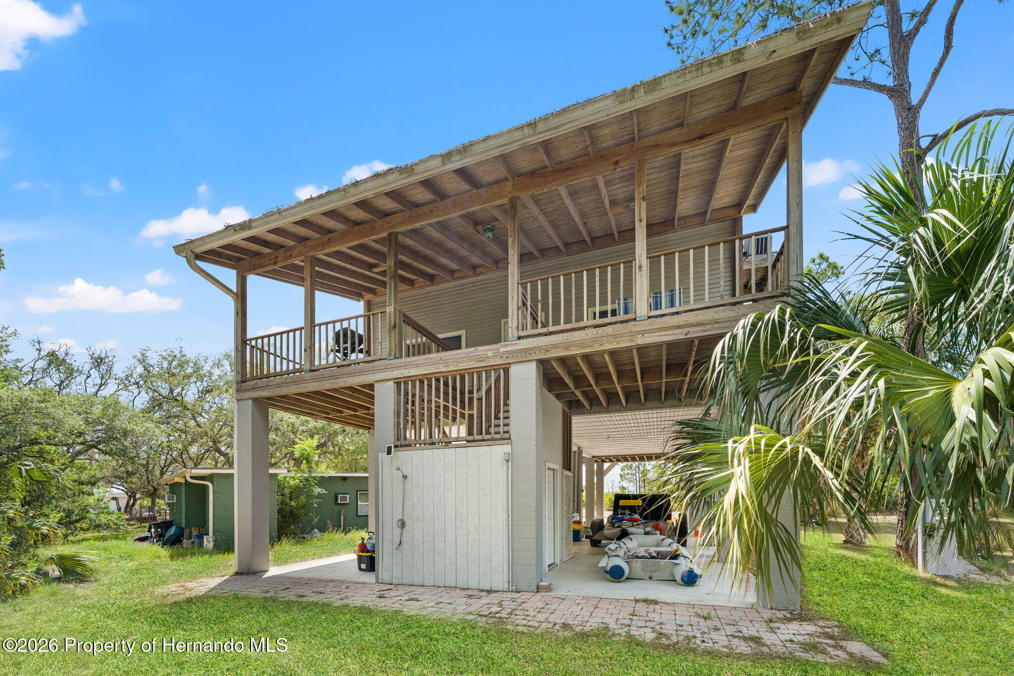 1566 Indian Bay Road Spring Hill, FL 34607 - Photo 4 of 56 a view of a house with a yard