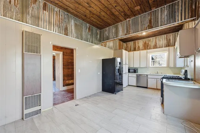 a view of a kitchen with a sink and dishwasher kitchen view