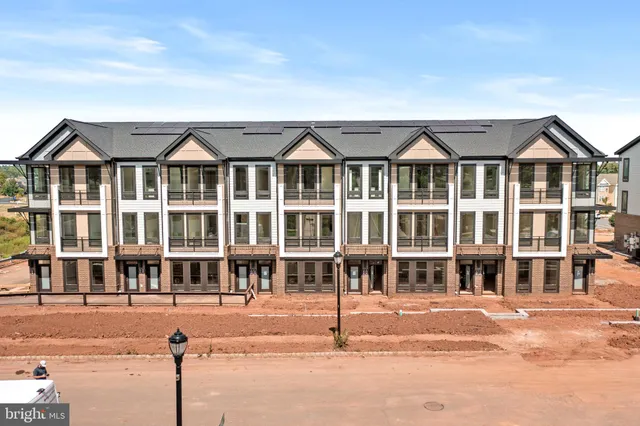 a front view of a building with a street