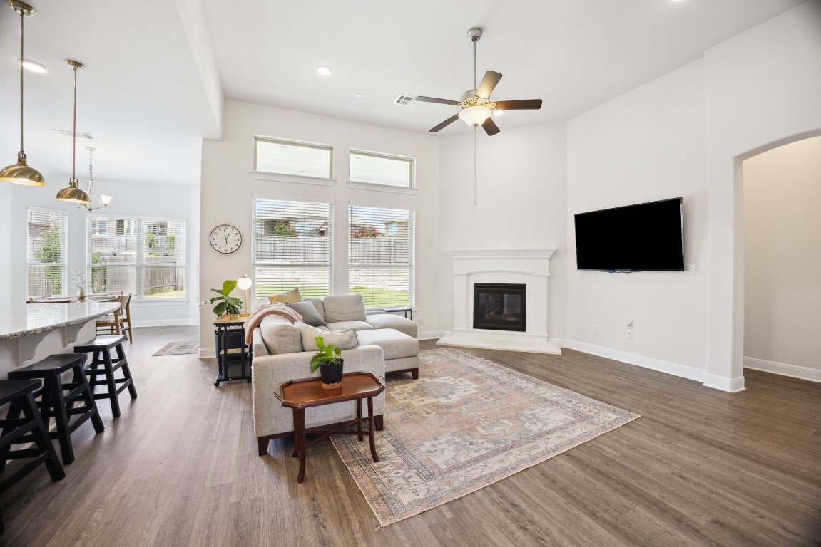 744 Founders Ridge Dripping Springs, TX 78620 - Photo 15 of 32 a living room with fireplace furniture and a flat screen tv