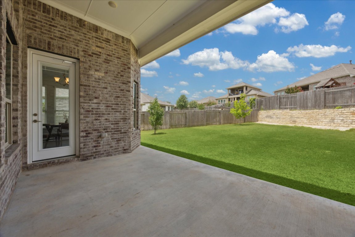 744 Founders Ridge Dripping Springs, TX 78620 - Photo 26 of 32 a view of a house with a yard